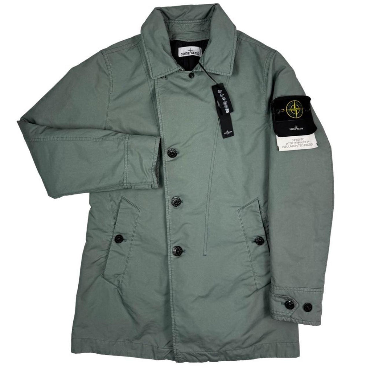 Stone Island green jacket with Primaloft insulation and iconic compass logo.