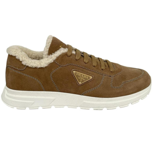 Prada brown suede trainers with shearling lining and logo detail.