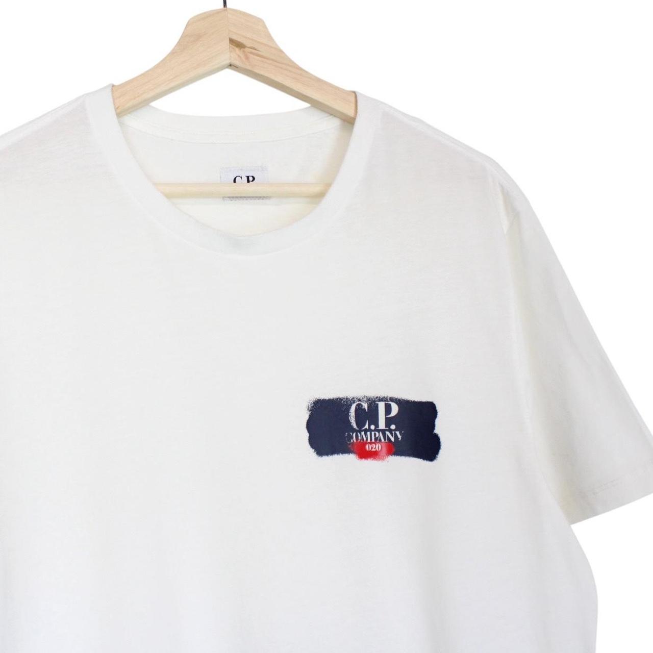 CP Company white short sleeve cotton t-shirt with chest logo print and pocket detail.