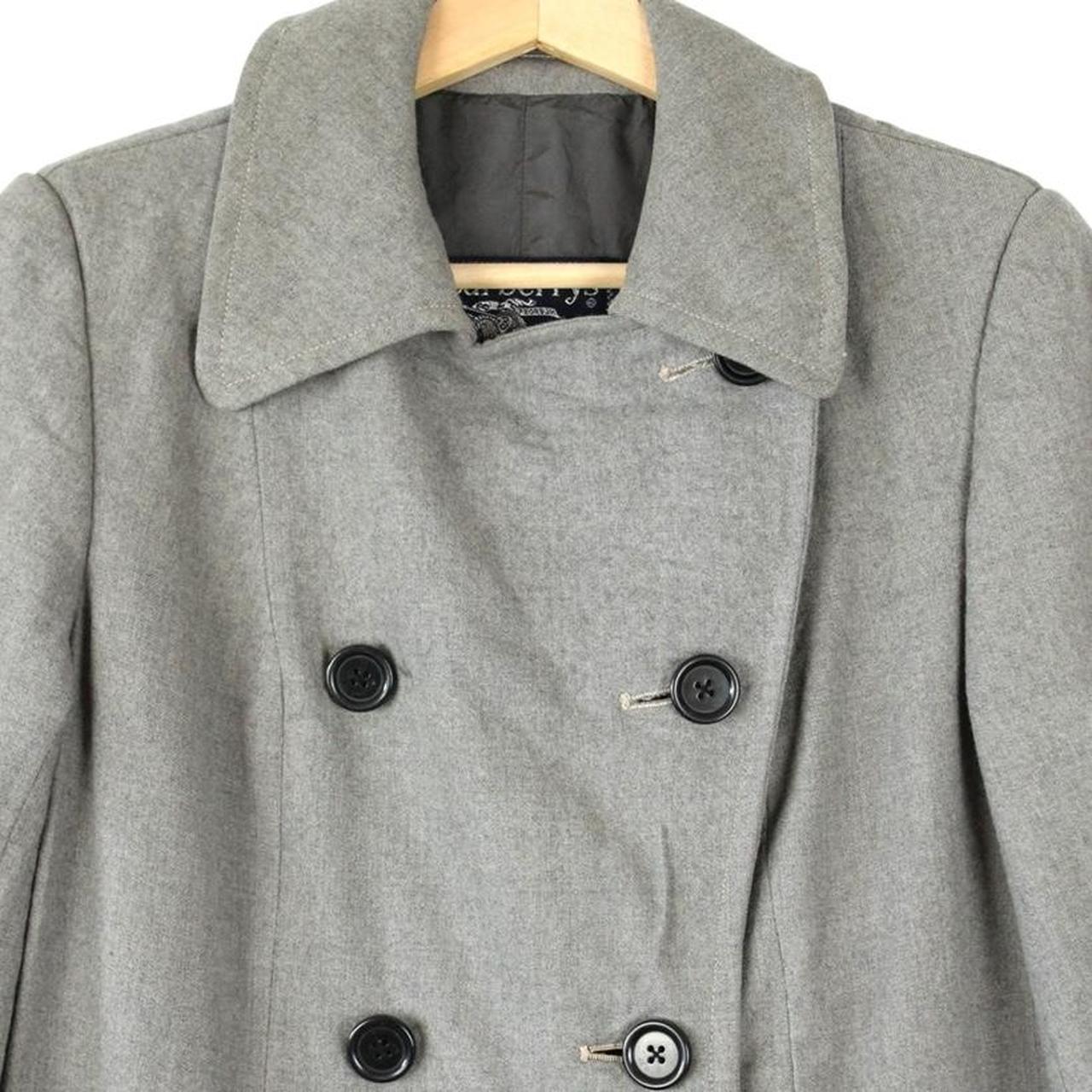 Burberry grey double breasted wool trench coat with classic check lining and logo buttons.