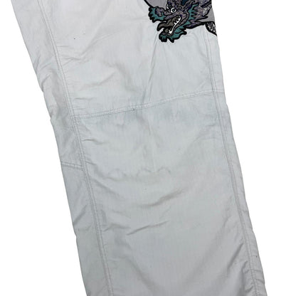 Palace grey joggers embroidered dragon design, made of nylon, size medium.