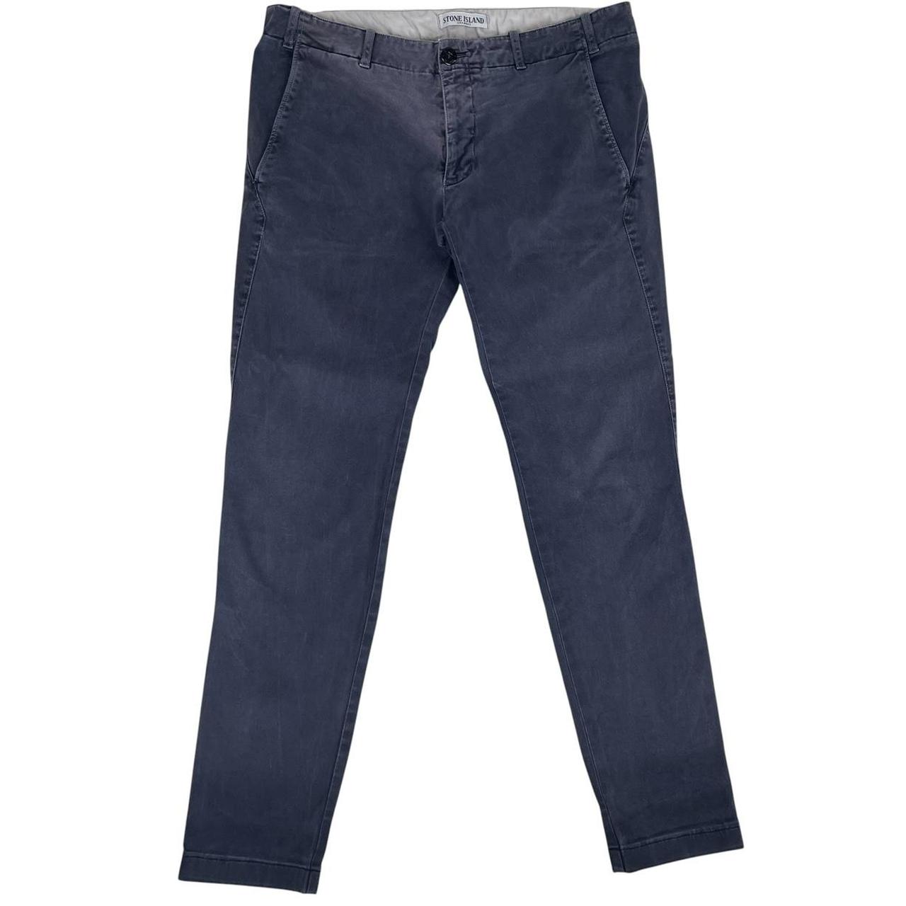 Stone Island navy blue slim fit cotton trousers with logo patch and fading details.