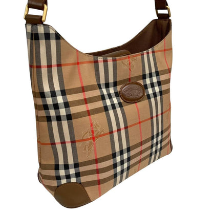 Burberry tan brown duffel bag featuring iconic Nova Check pattern and leather accents.