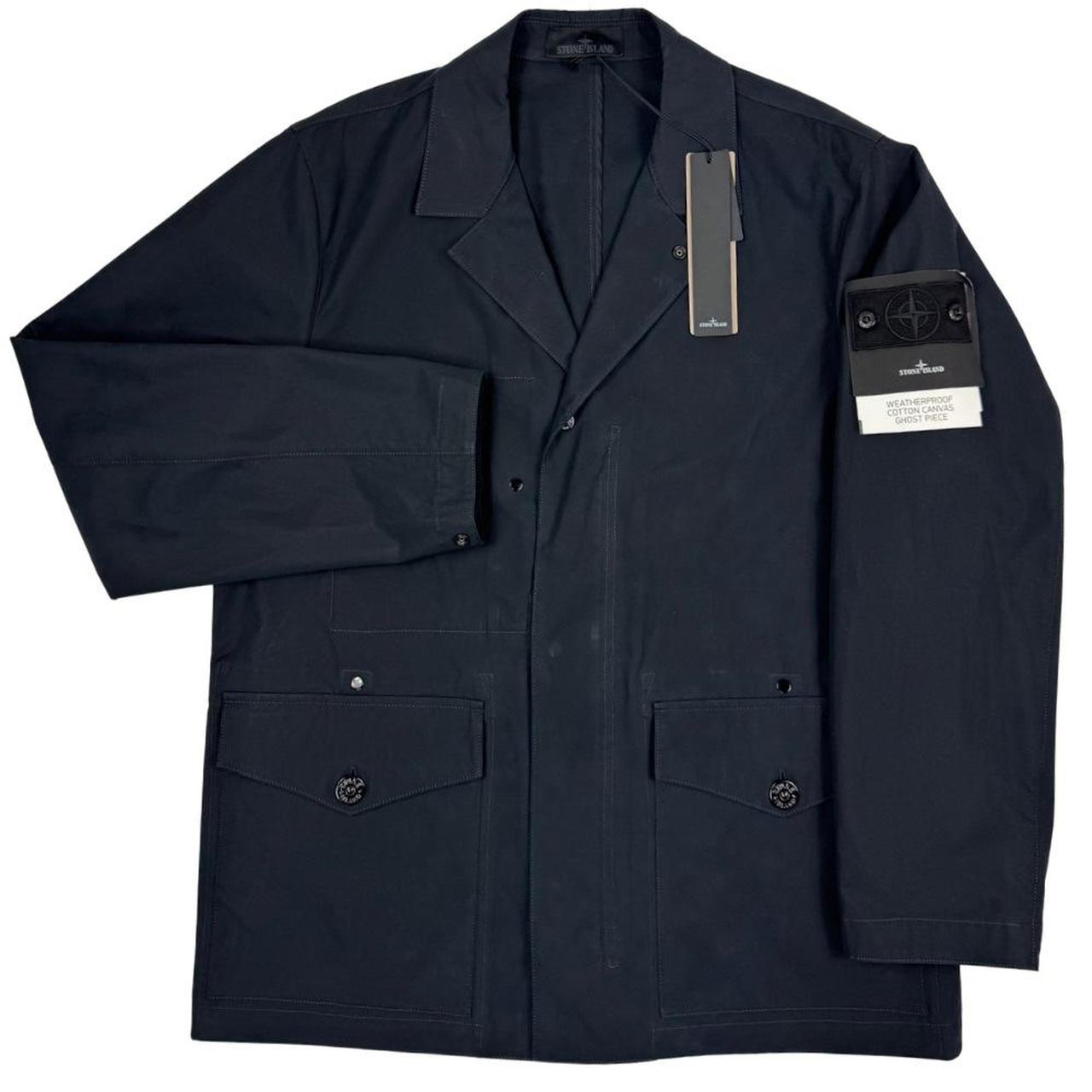 Stone Island navy blue jacket weatherproof cotton canvas with ghost logo detail.