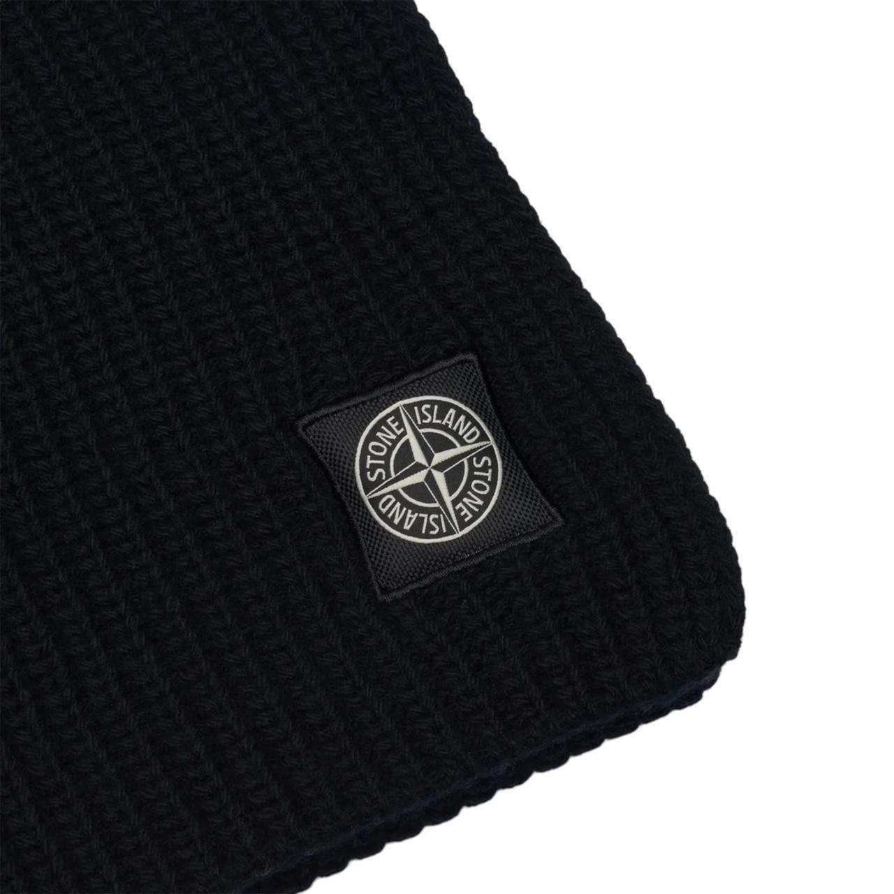 Stone Island black wool scarf with ribbed texture and embroidered logo patch.