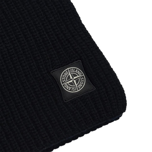 Stone Island black wool scarf with ribbed texture and embroidered logo patch.
