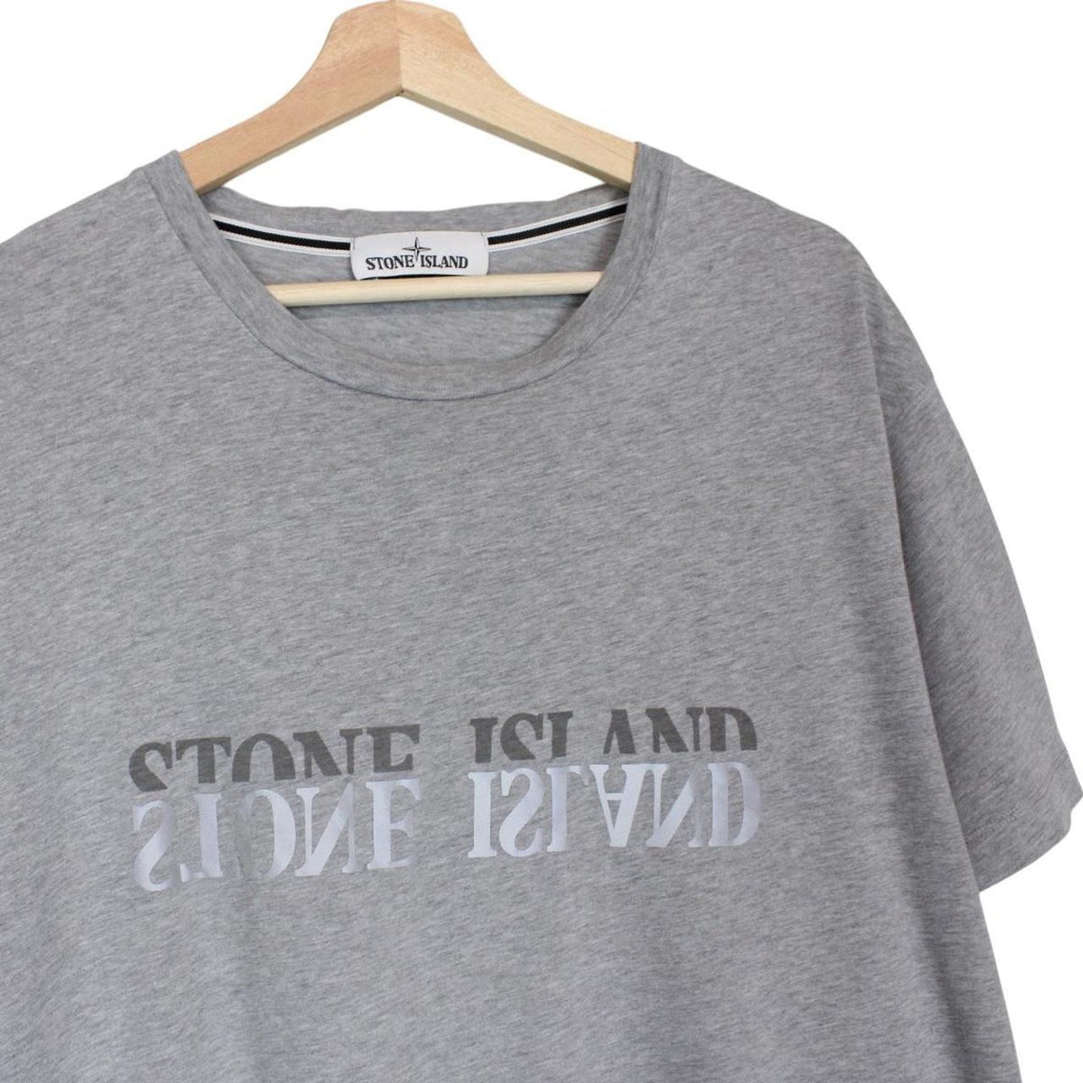 Stone Island grey short sleeve t-shirt with reflective logo and cotton material.