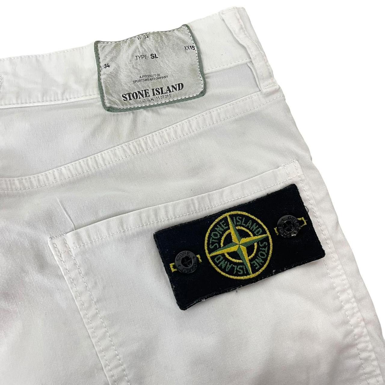 Stone Island white slim fit cotton trousers with logo patch and front mark.