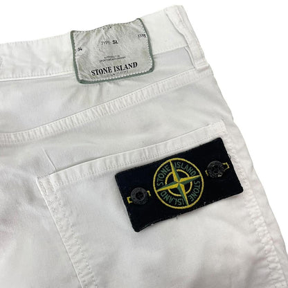 Stone Island white slim fit cotton trousers with logo patch and front mark.