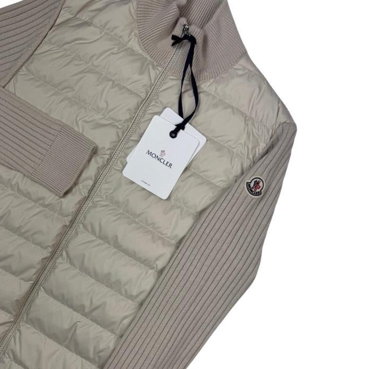 Moncler beige full zip jacket with logo detail and nylon/wool blend material.