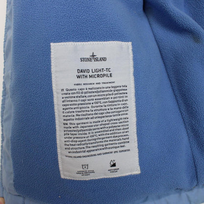 Stone Island blue jacket with logo patch and micropile texture, size small.