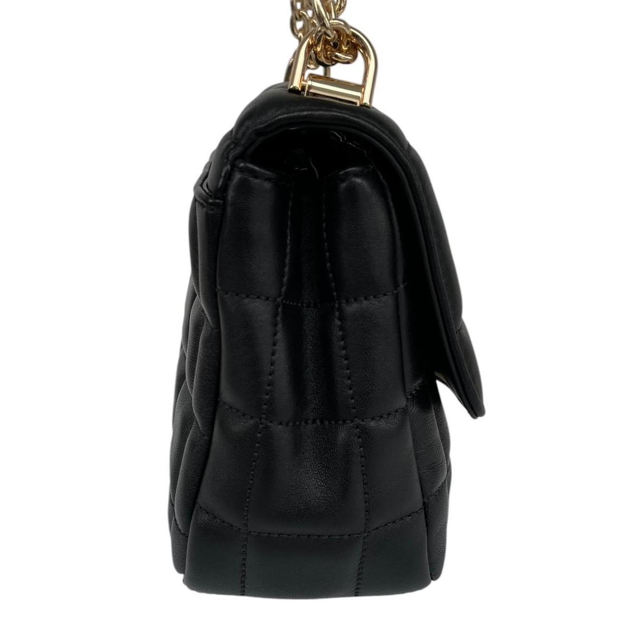 Michael Kors black duffel bag with quilted pattern and logo detail, pre-loved condition.