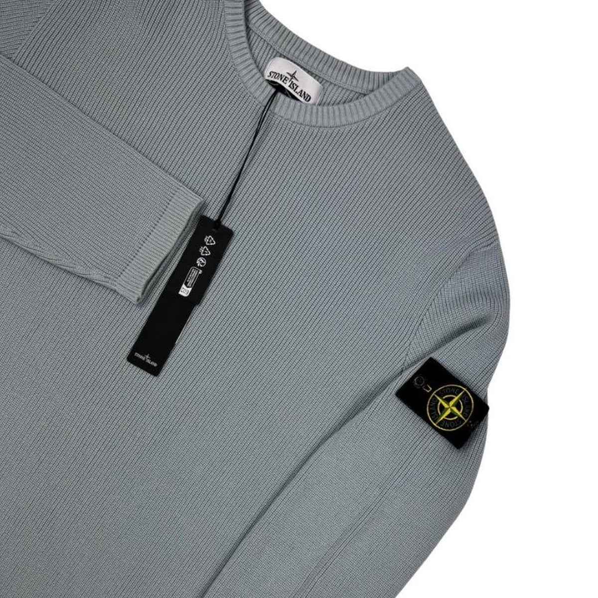 Stone Island grey waffle knit jumper with logo patch and organic cotton material.