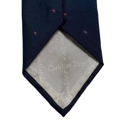 Christian Dior navy blue tie with silk blend, featuring subtle sheen and classic design.