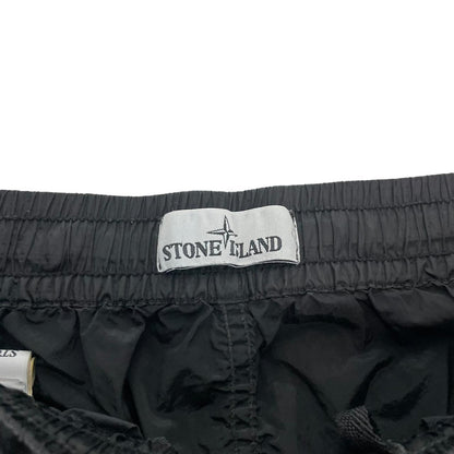 Stone Island black cargo trousers with logo patch and nylon material, size W33.