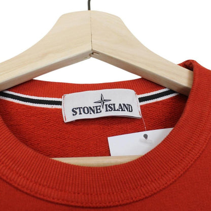 Stone Island red cotton sweatshirt with embroidered logo and ribbed cuffs.
