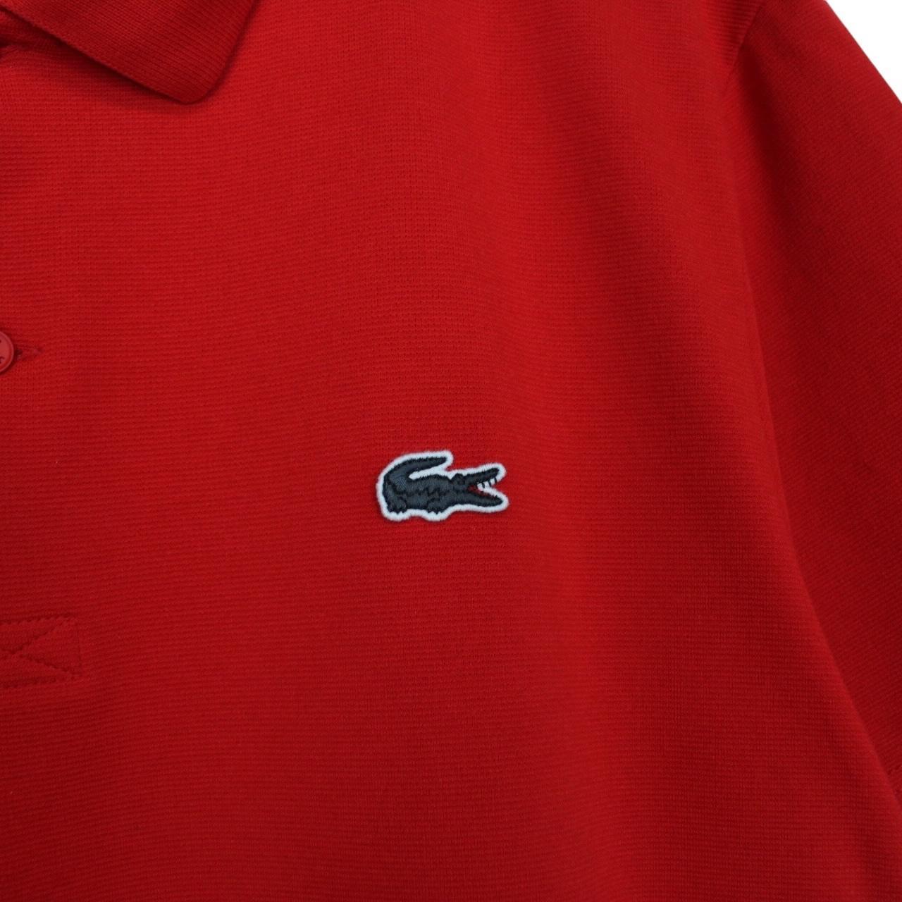 Lacoste red short sleeve polo shirt with embroidered crocodile logo, cotton material.