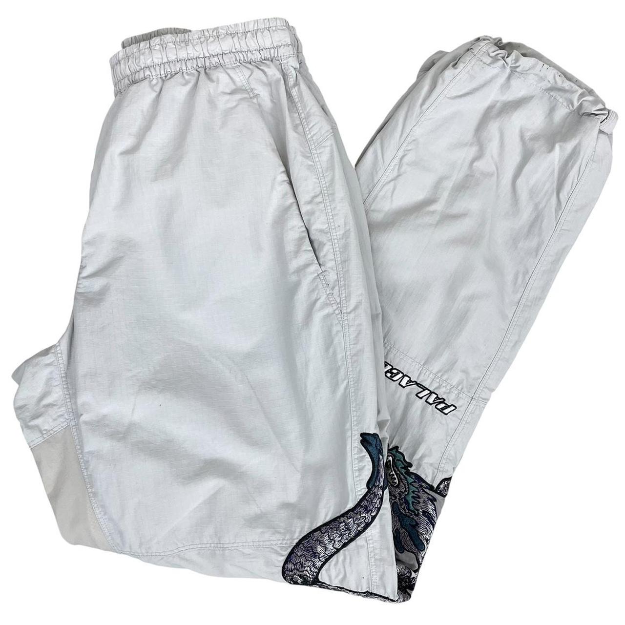 Palace grey joggers embroidered dragon design, made of nylon, size medium.