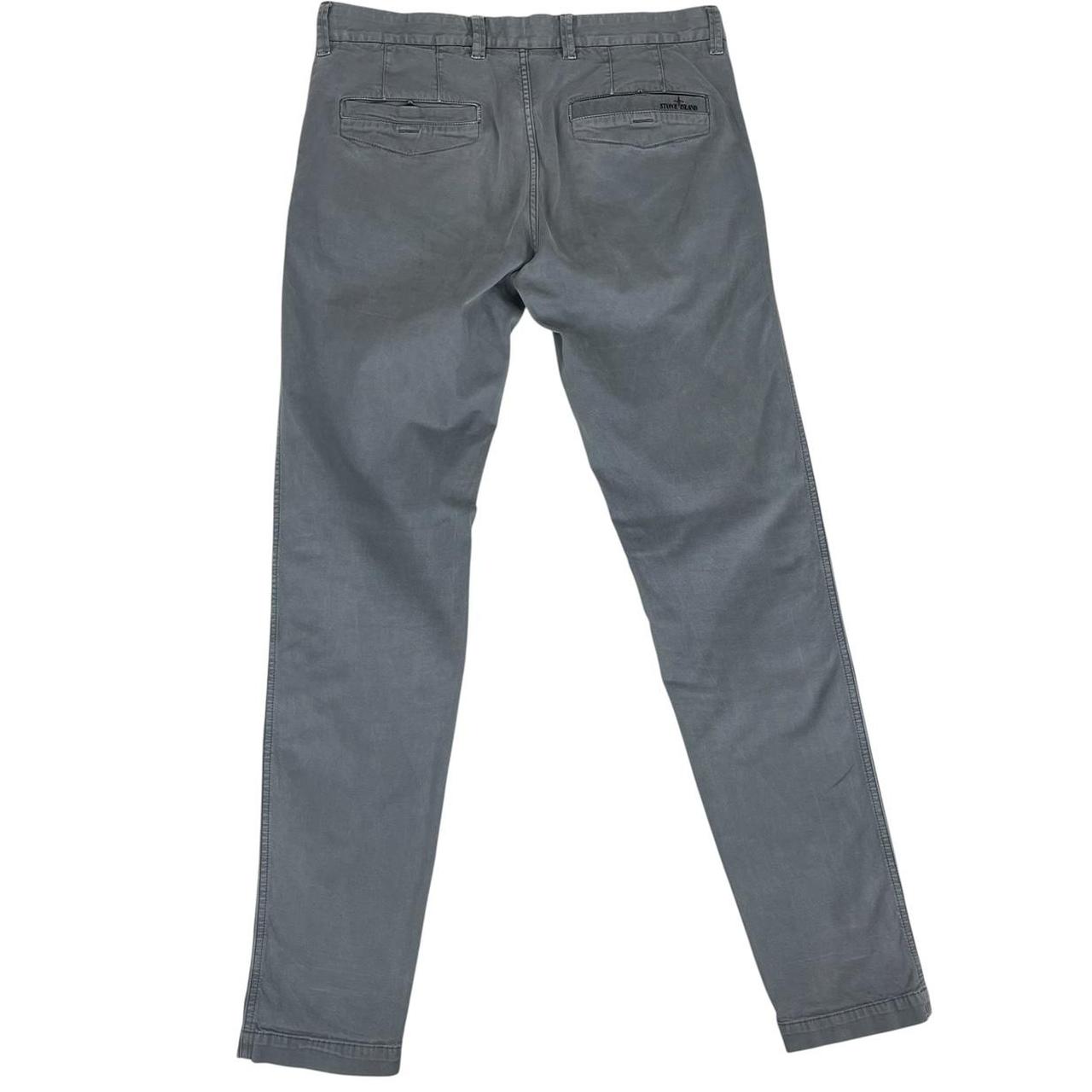 Stone Island grey slim fit cotton trousers with logo patch and classic design.
