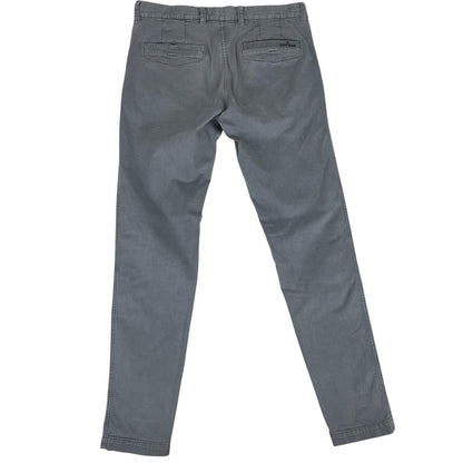 Stone Island grey slim fit cotton trousers with logo patch and classic design.