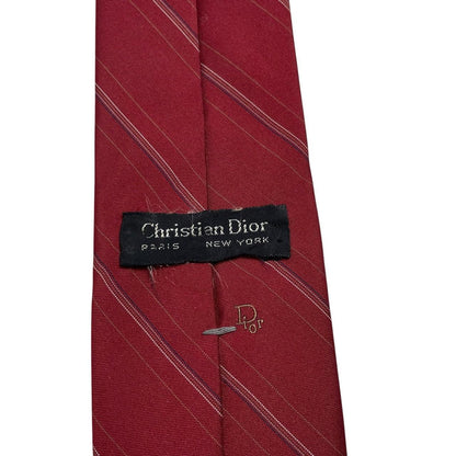 Christian Dior burgundy striped tie with subtle logo detail and vintage design.
