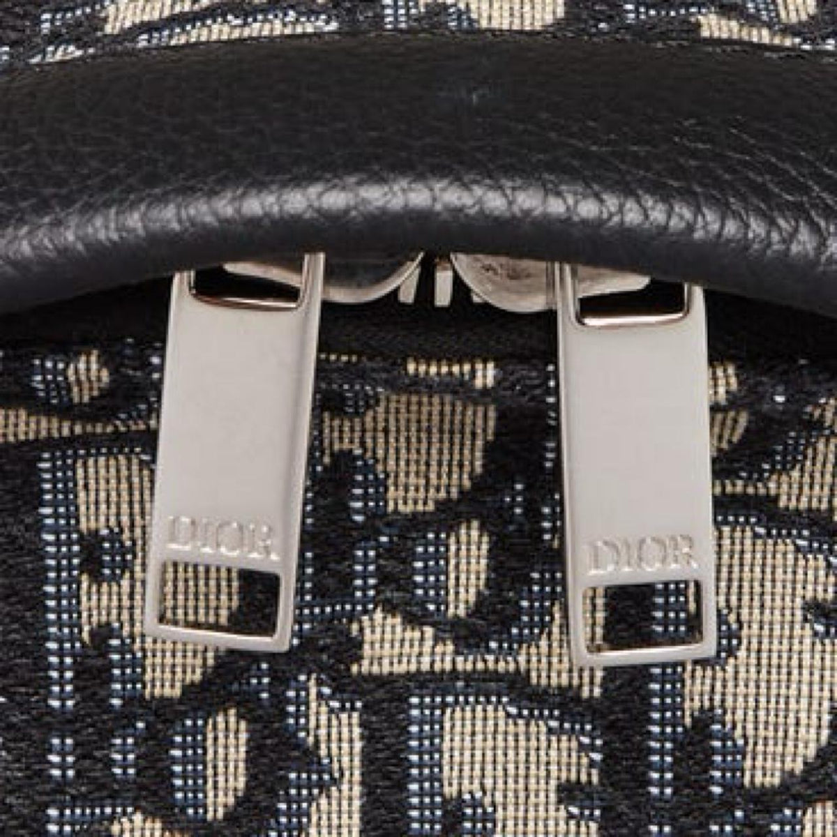 Dior beige and black oblique jacquard monogram rider backpack with logo pattern.