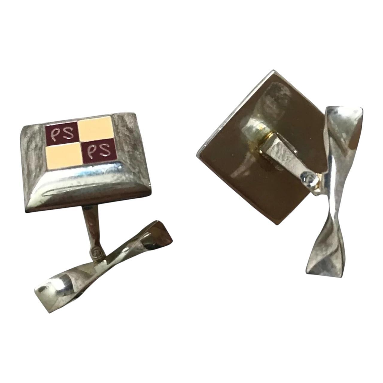 Paul Smith silver cufflinks with beveled edge and engraved "PS" logo.