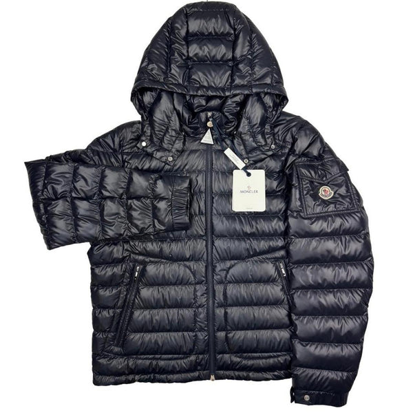 Moncler navy blue hooded puffer jacket with logo patch and nylon material.