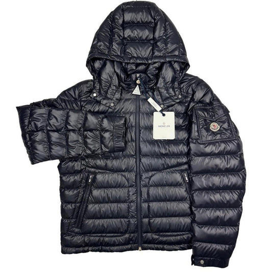 Moncler navy blue hooded puffer jacket with logo patch and nylon material.