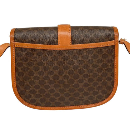 CELINE brown and tan duffel bag with Macadam pattern and leather/canvas material.