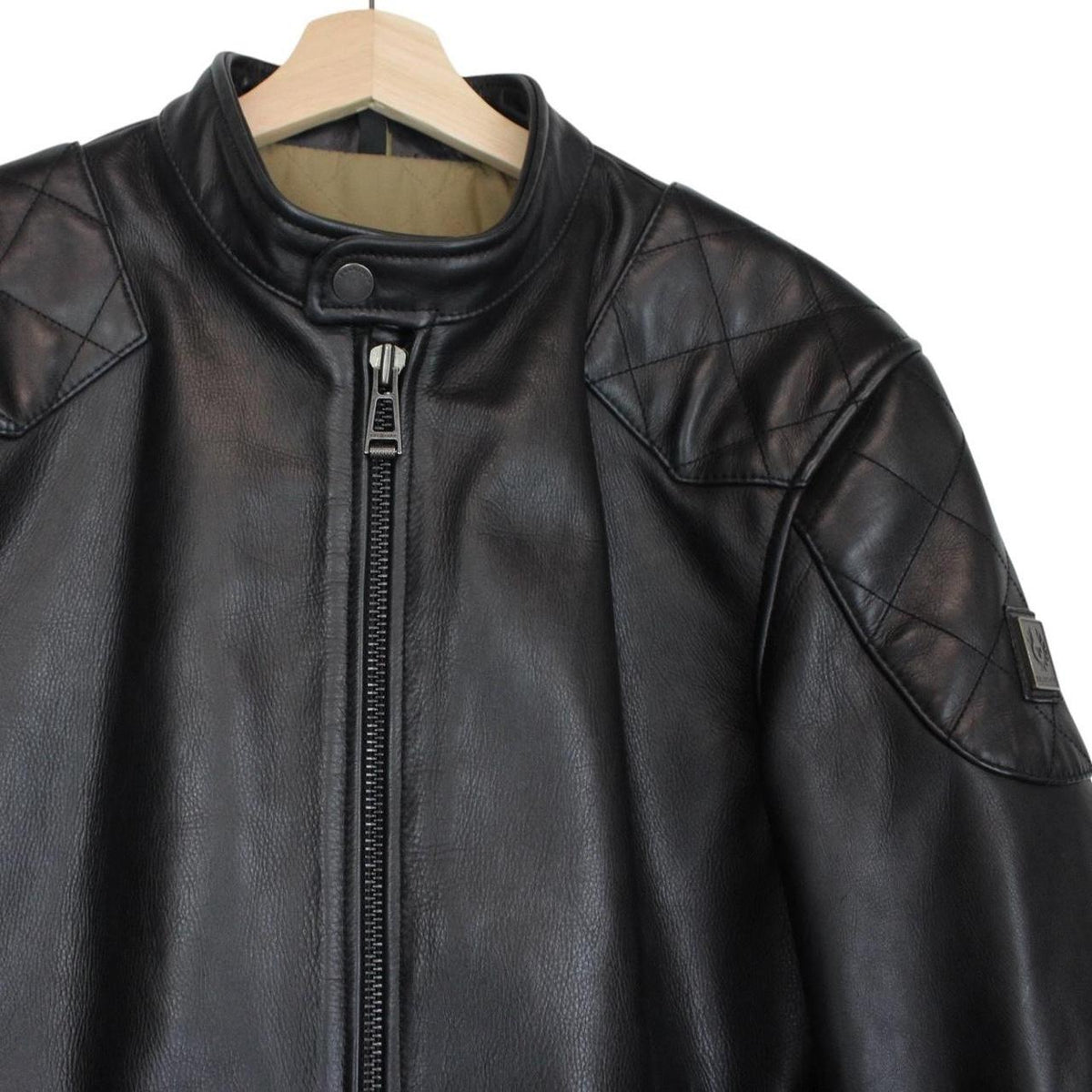 Belstaff black leather jacket with full zip and classic logo detailing.