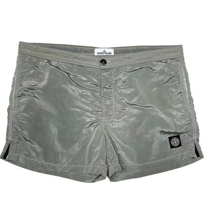 Stone Island green swim shorts with logo patch and nylon metal material.