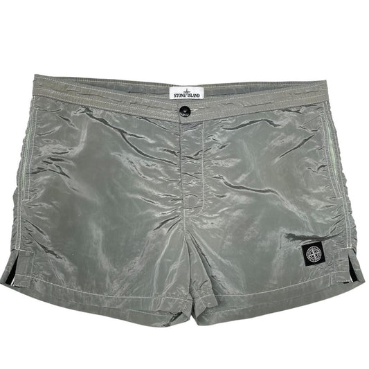 Stone Island green swim shorts with logo patch and nylon metal material.
