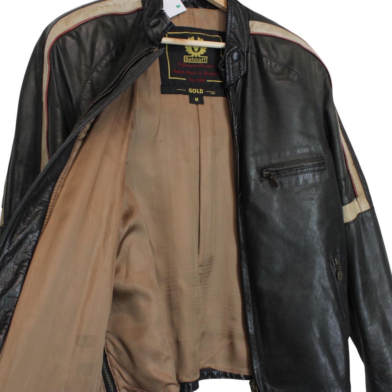 Belstaff beige and black leather jacket with vintage logo and cream detailing.