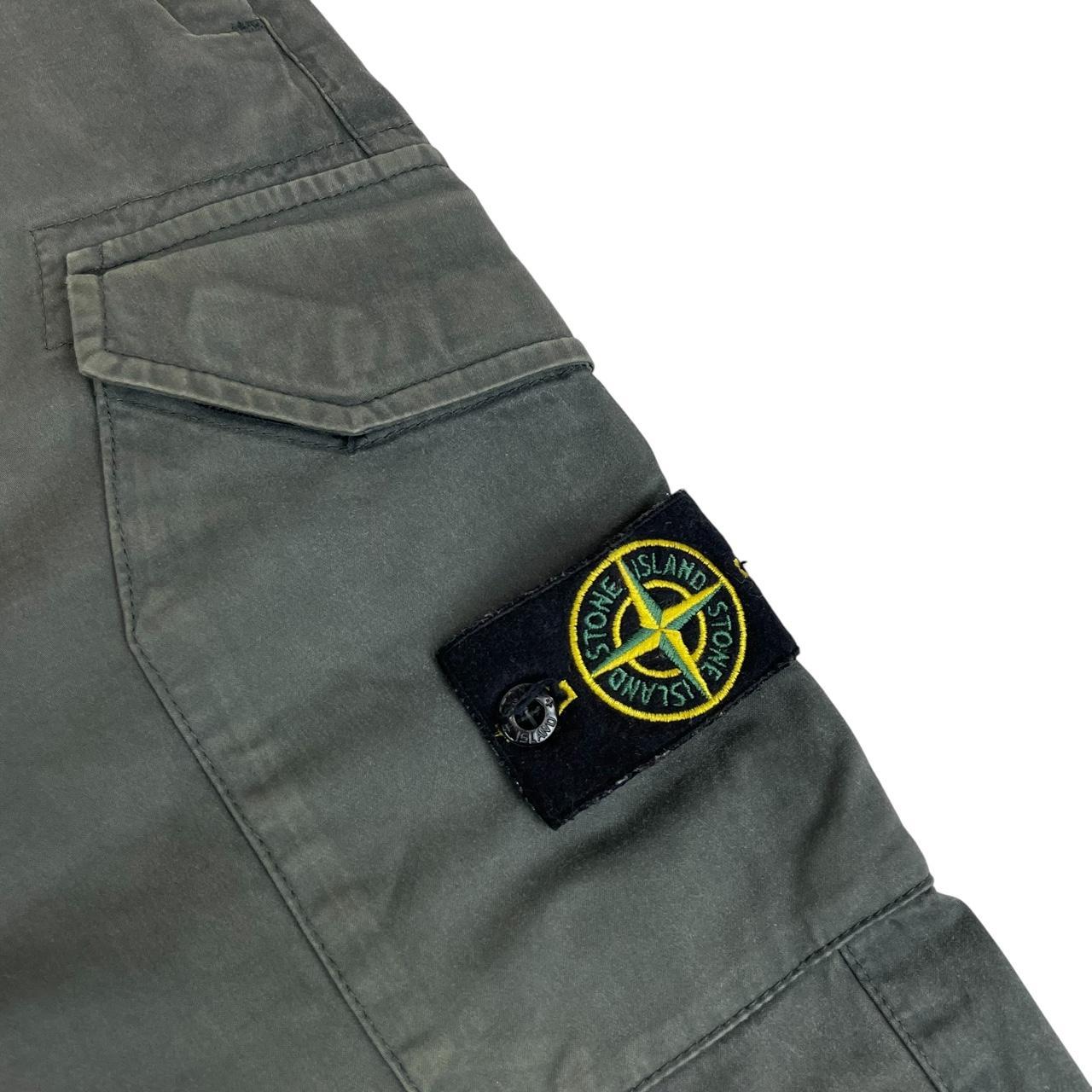 Stone Island grey cargo trousers with logo patch and pockets, visible discolouration.