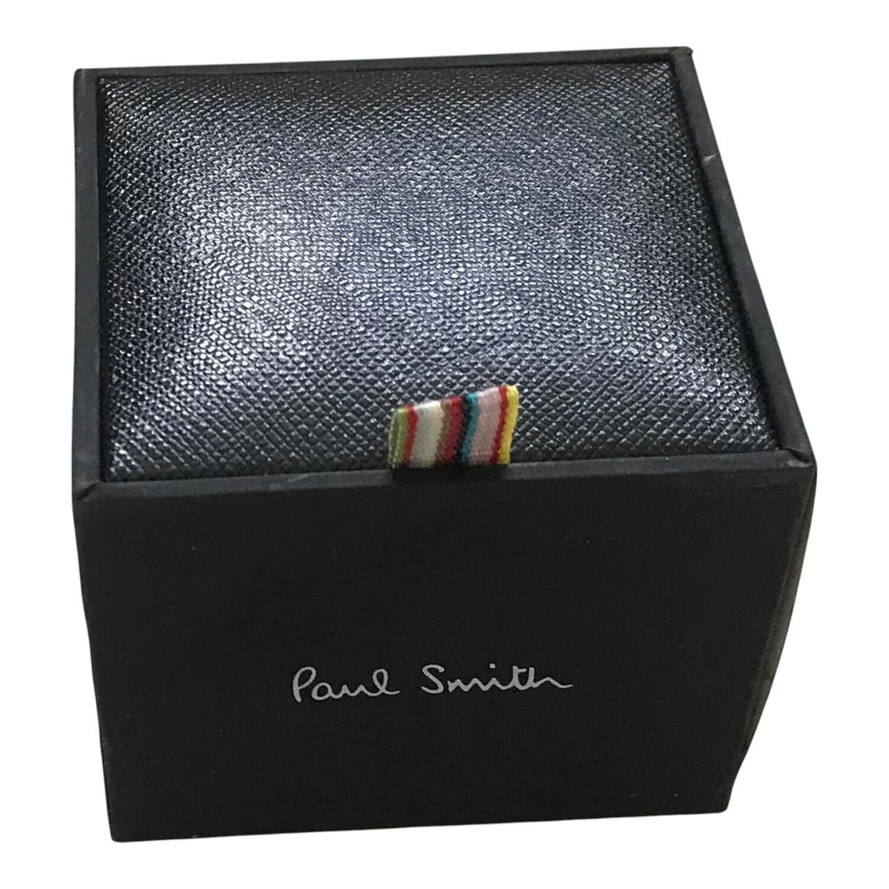 Paul Smith gunmetal cufflinks 2D spider design with intricate detailing and brand logo.