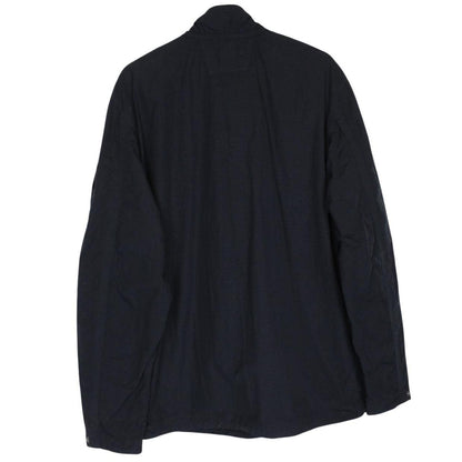 CP Company navy blue jacket 1/4 zip with lens detail and flat nylon material.