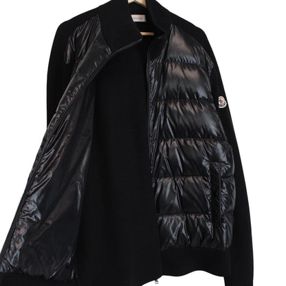 Moncler black cardigan jacket with full zip, wool/nylon blend, and logo detail.