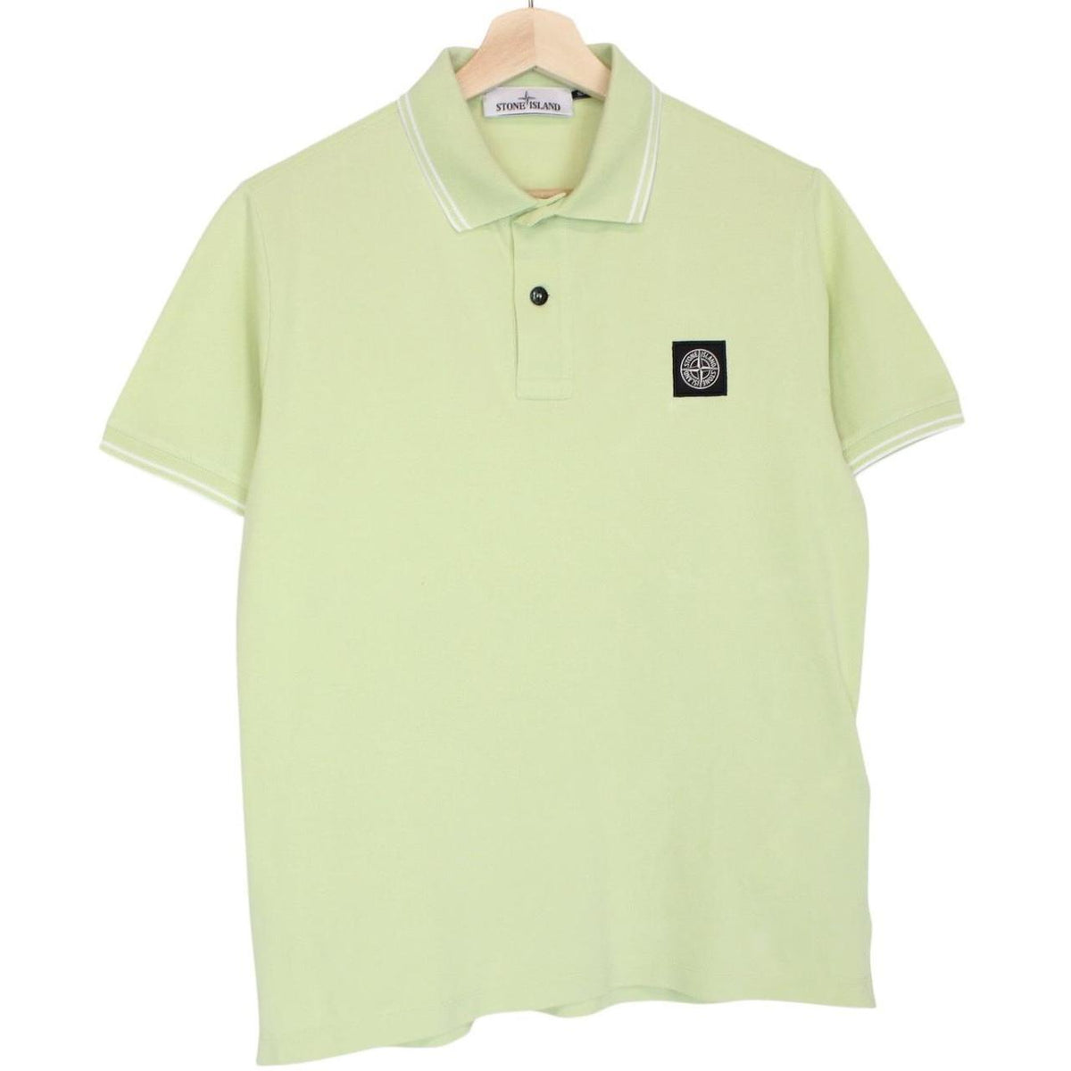 Stone Island green polo shirt with compass logo, cotton material, short sleeves.