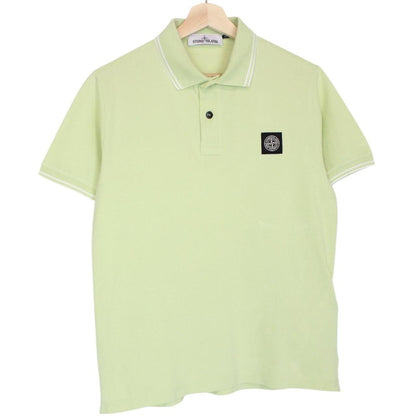 Stone Island green polo shirt with compass logo, cotton material, short sleeves.
