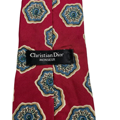 Christian Dior red silk tie with geometric pattern and logo detail.