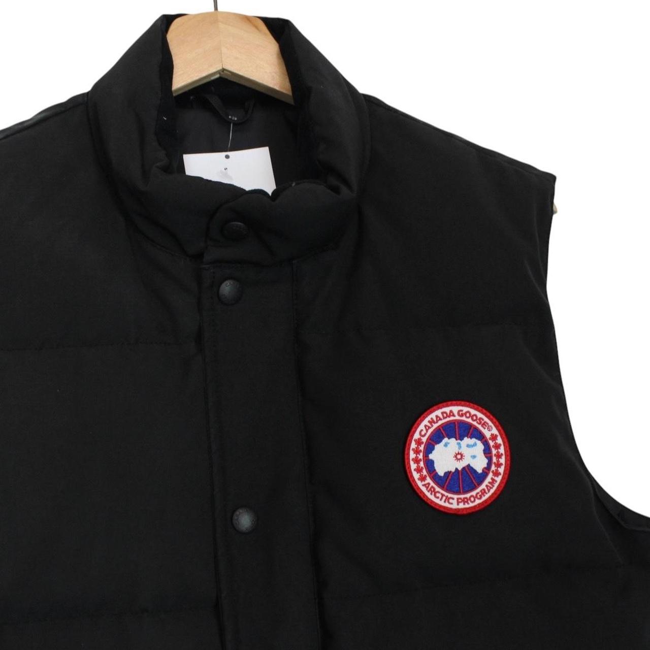 Canada Goose black down gilet with logo patch and original tags, very good condition.