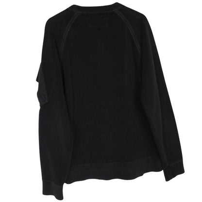CP Company black fleece jumper with raglan sleeves and iconic lens detail.
