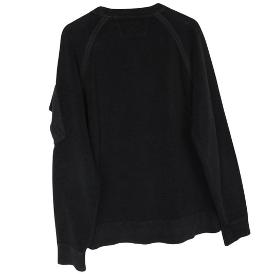 CP Company black fleece jumper with raglan sleeves and iconic lens detail.