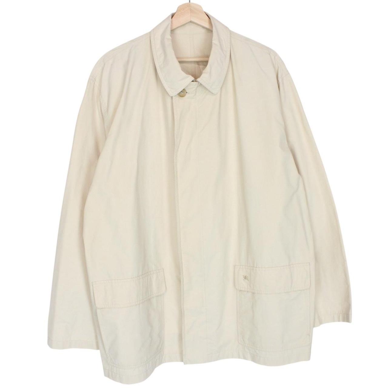 Burberry beige coat with classic check pattern and logo detail on collar.