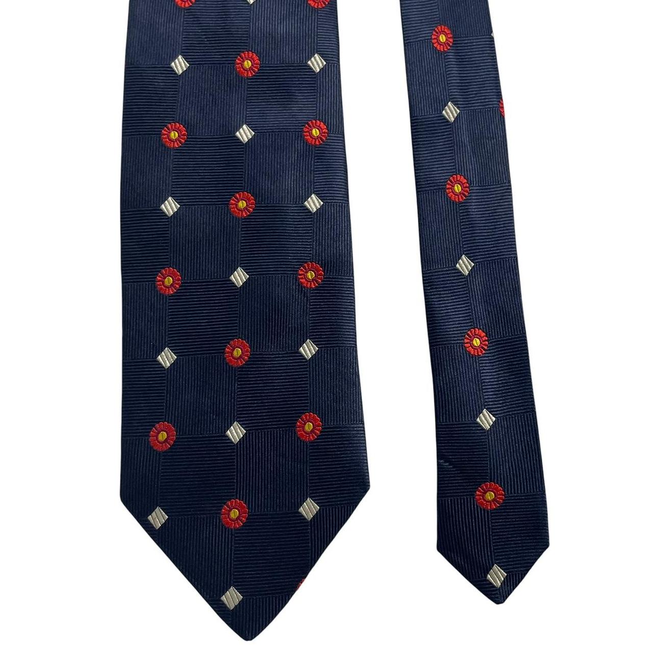 Ermenegildo Zegna navy blue silk tie with subtle sheen and elegant texture.