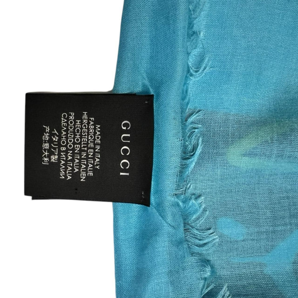 Gucci black and blue modal silk scarf with GG star pattern and logo.