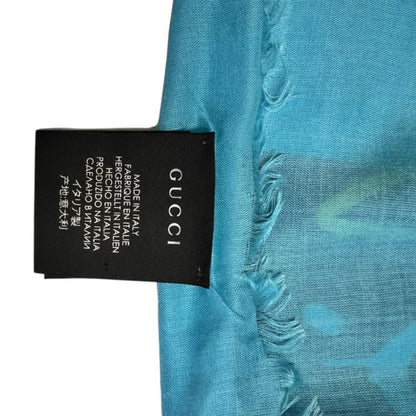 Gucci black and blue modal silk scarf with GG star pattern and logo.