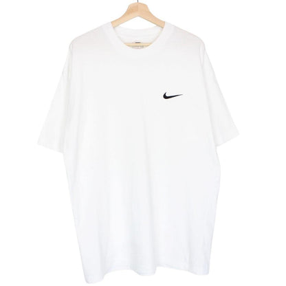Nike white short sleeve cotton t-shirt with pocket and vintage logo detail.
