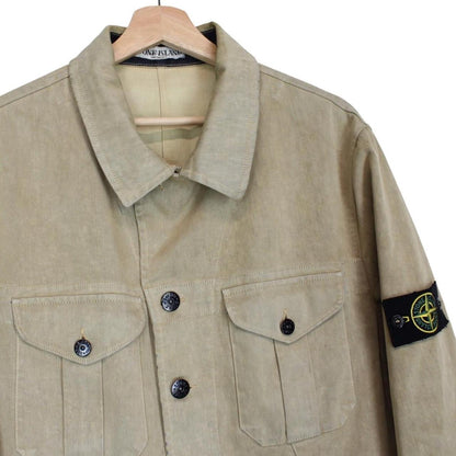 Stone Island beige multi-pocket jacket with logo patch and linen material.